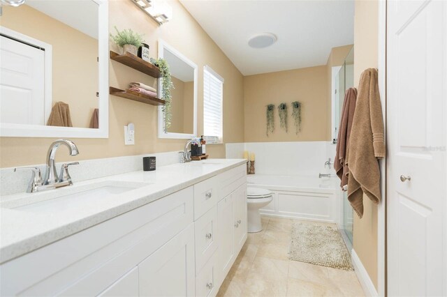 11913 Butler Woods Cir, Riverview, FL 33579 - bathroom with double vanity, a garden tub, and tile patterned flooring