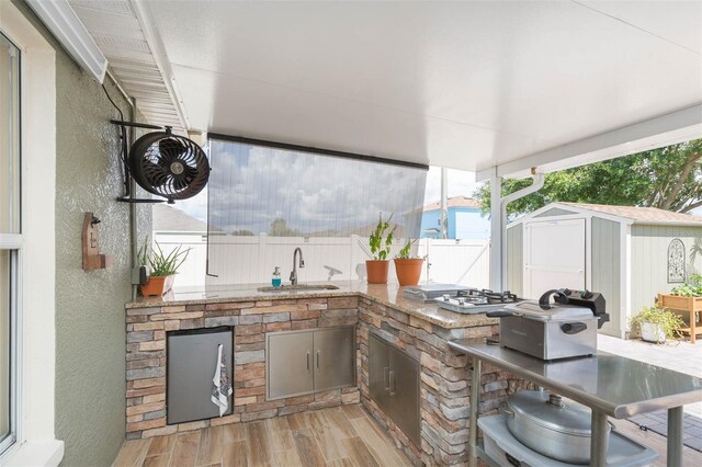 11913 Butler Woods Cir, Riverview, FL 33579 - view of patio / terrace with exterior kitchen and a shed