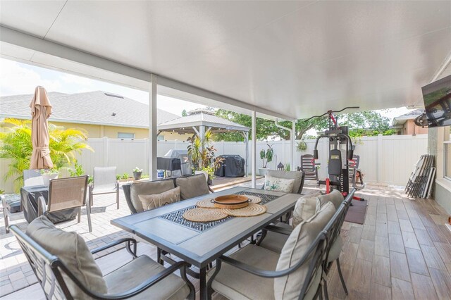 11913 Butler Woods Cir, Riverview, FL 33579 - fenced backyard featuring outdoor dining space, a patio, and an outdoor hangout area