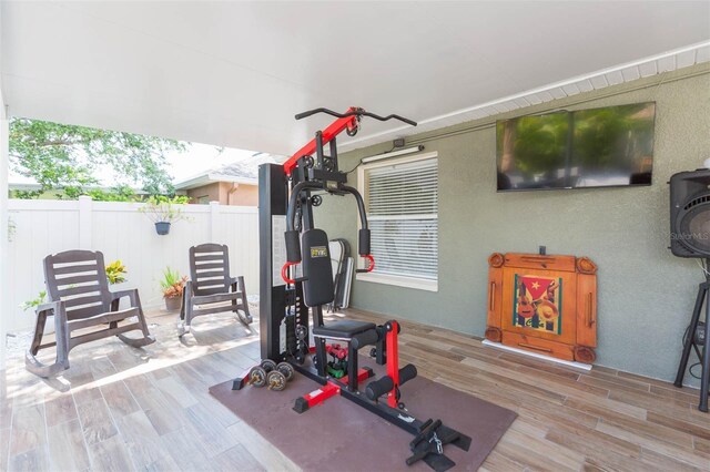11913 Butler Woods Cir, Riverview, FL 33579 - workout area with wood finished floors