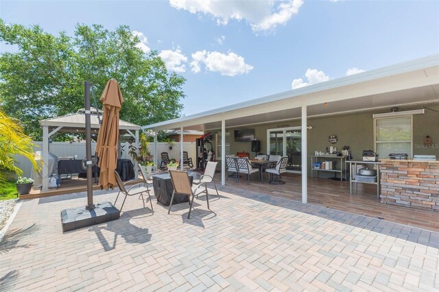 11913 Butler Woods Cir, Riverview, FL 33579 - view of patio with outdoor dining area and a gazebo