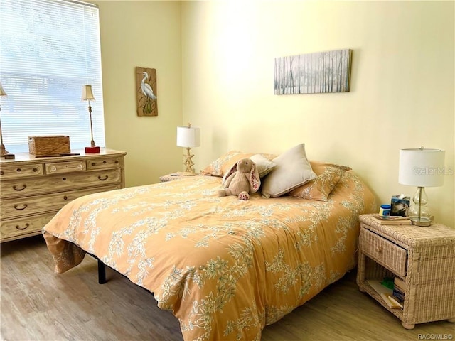 6847 E Queensbury Ln, Inverness, FL 34452 - bedroom with wood finished floors