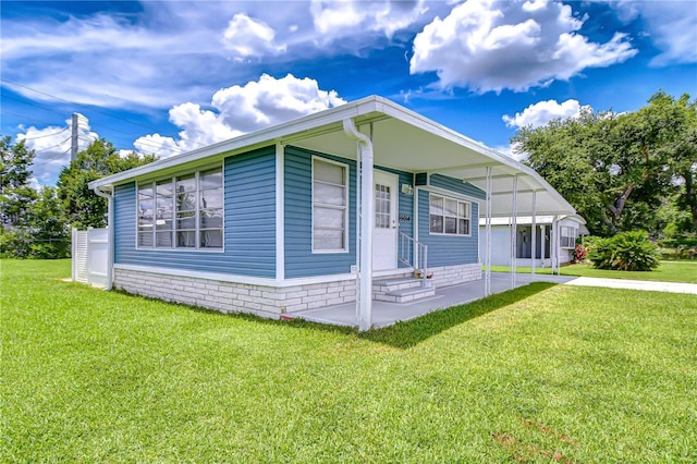 35014 Carl Ave, Zephyrhills, FL 33541 - view of front facade with a front yard, entry steps, and driveway