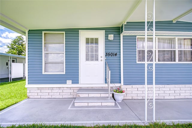 35014 Carl Ave, Zephyrhills, FL 33541 - view of exterior entry with covered porch