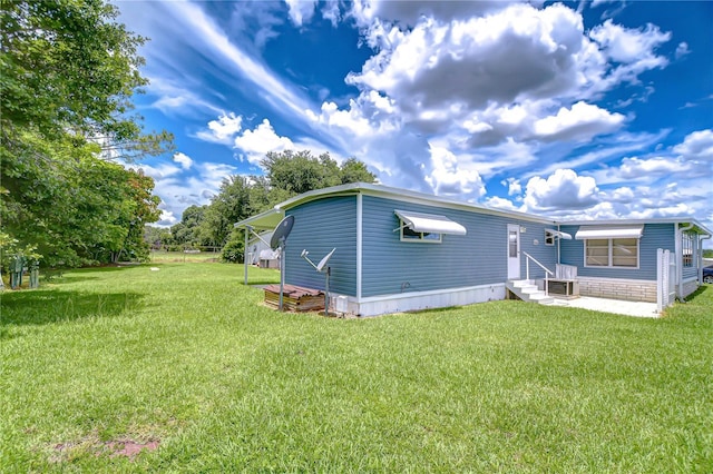 35014 Carl Ave, Zephyrhills, FL 33541 - view of front of house with entry steps and a front lawn