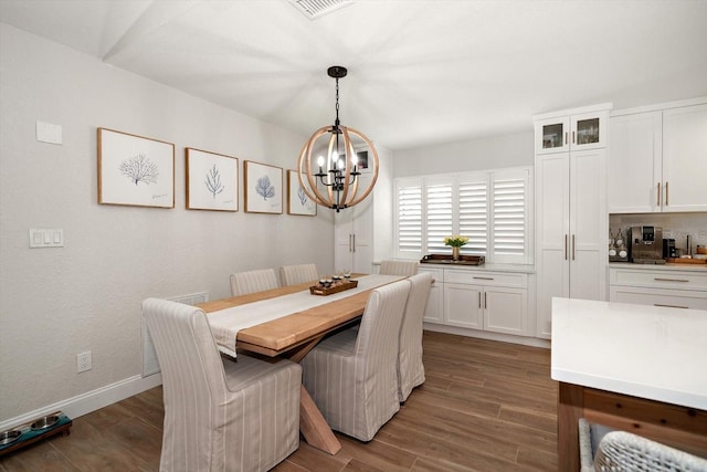 11763 Saree Ct, Largo, FL 33778 - dining area featuring a chandelier and dark wood finished floors