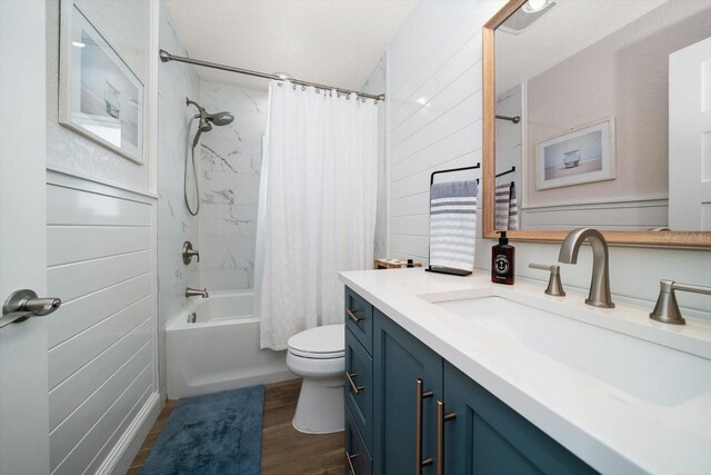 11763 Saree Ct, Largo, FL 33778 - full bathroom featuring vanity, shower / tub combo with curtain, and wood finished floors