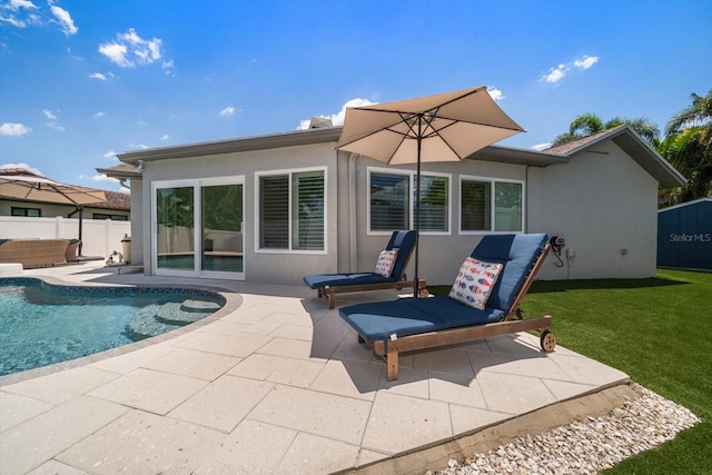 11763 Saree Ct, Largo, FL 33778 - rear view of property with a patio area and stucco siding