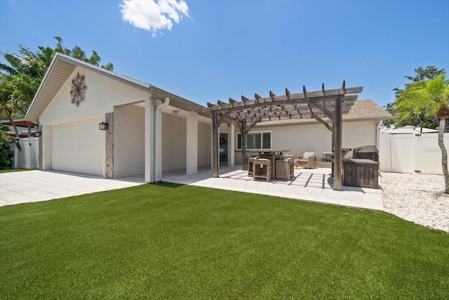 11763 Saree Ct, Largo, FL 33778 - rear view of property with a pergola, stucco siding, an attached garage, driveway, and a patio