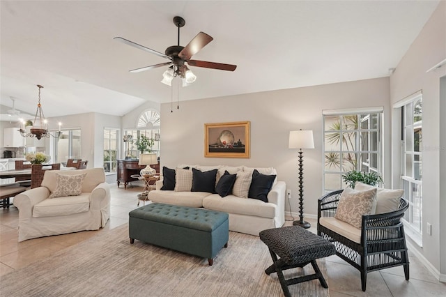 3854 Lyndhurst Ct, Sarasota, FL 34235 - living area featuring ceiling fan, light tile patterned floors, lofted ceiling, and a chandelier