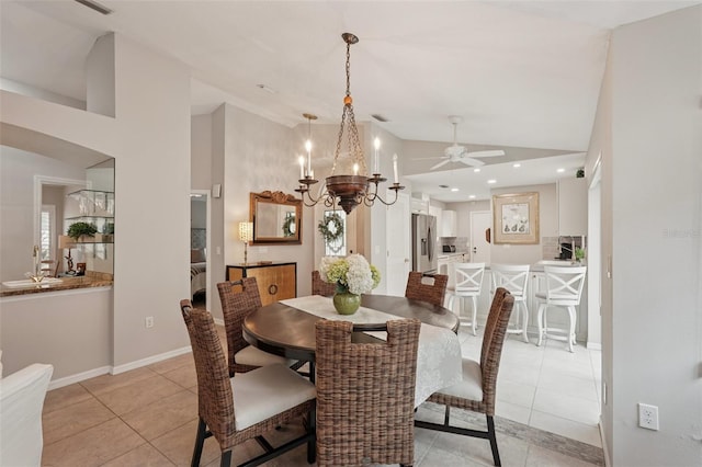 3854 Lyndhurst Ct, Sarasota, FL 34235 - dining room featuring light tile patterned flooring, vaulted ceiling, a chandelier, and ceiling fan