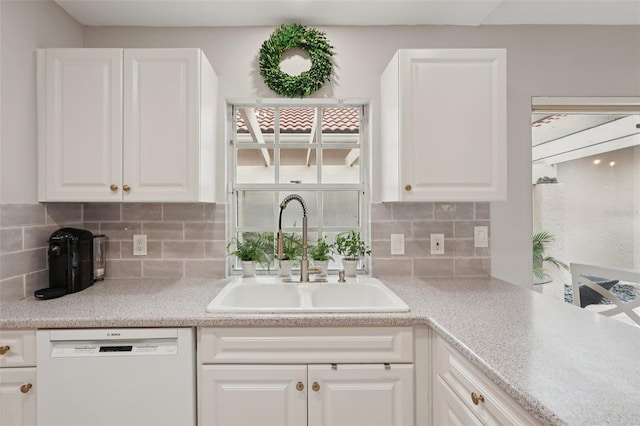 3854 Lyndhurst Ct, Sarasota, FL 34235 - kitchen featuring dishwasher, white cabinets, and decorative backsplash
