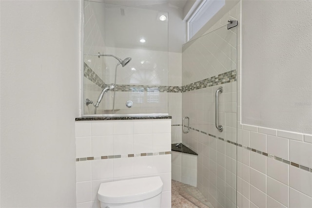 3854 Lyndhurst Ct, Sarasota, FL 34235 - bathroom with tile walls and a stall shower
