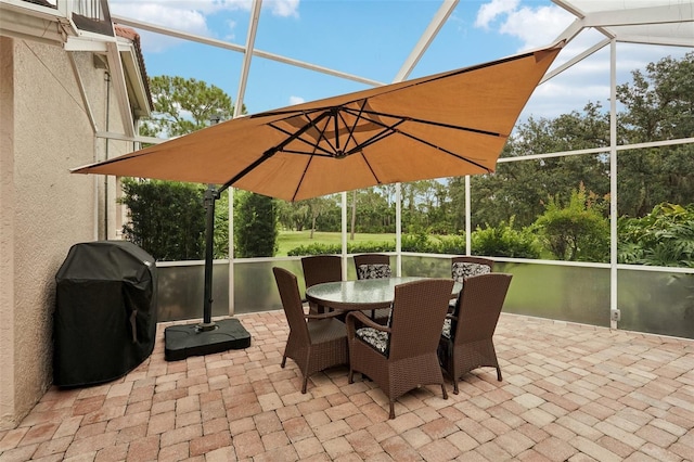 3854 Lyndhurst Ct, Sarasota, FL 34235 - view of patio / terrace with grilling area, a lanai, and outdoor dining space