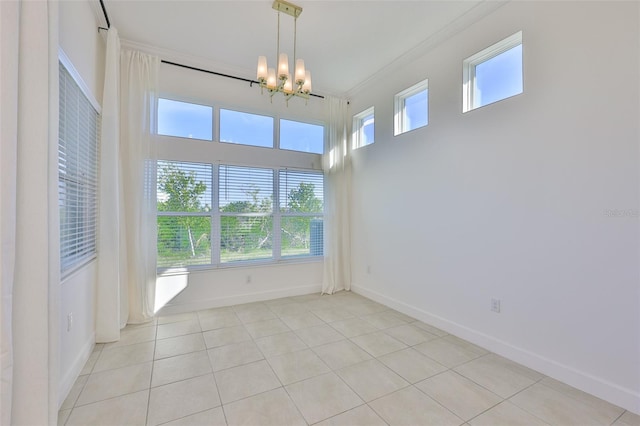 955 Signet Dr, Apollo Beach, FL 33572 - unfurnished room with a chandelier, crown molding, and light tile patterned floors
