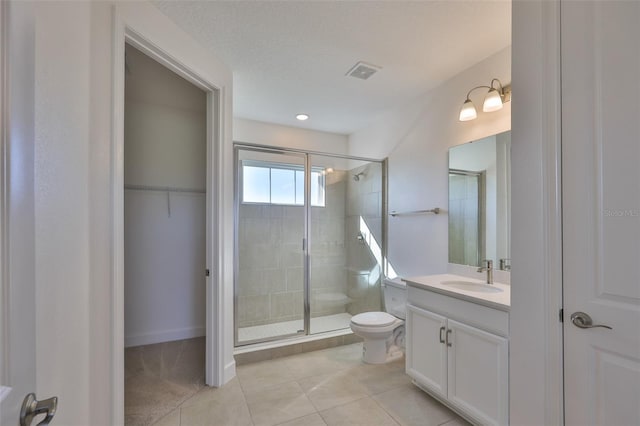 955 Signet Dr, Apollo Beach, FL 33572 - full bathroom with a shower stall, vanity, tile patterned flooring, and a spacious closet