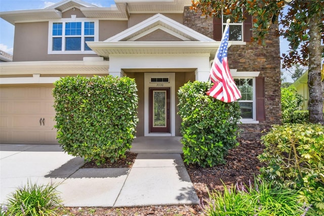 3530 Brook Crossing Dr, Brandon, FL 33511 - entrance to property with stone siding, stucco siding, and an attached garage