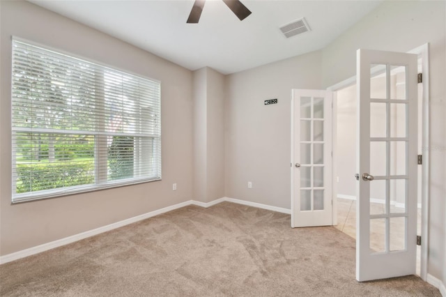 3530 Brook Crossing Dr, Brandon, FL 33511 - unfurnished room featuring french doors, carpet, plenty of natural light, and a ceiling fan