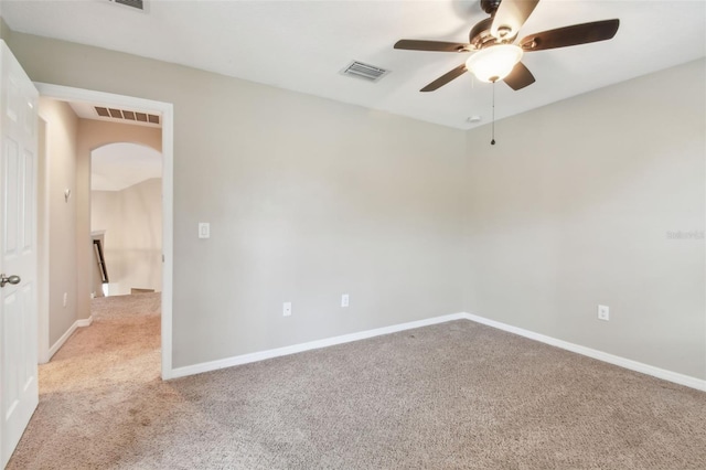 3530 Brook Crossing Dr, Brandon, FL 33511 - unfurnished room with light colored carpet, arched walkways, and a ceiling fan