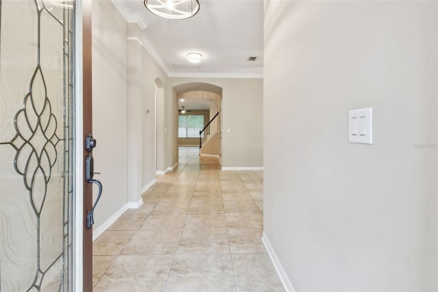 3530 Brook Crossing Dr, Brandon, FL 33511 - foyer featuring arched walkways, crown molding, and light tile patterned floors