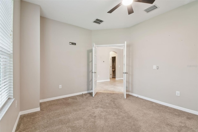 3530 Brook Crossing Dr, Brandon, FL 33511 - unfurnished room featuring light colored carpet, ceiling fan, and arched walkways