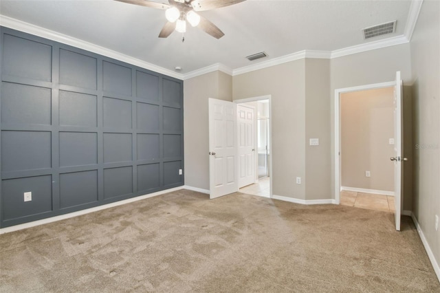 3530 Brook Crossing Dr, Brandon, FL 33511 - unfurnished bedroom featuring a decorative wall, light colored carpet, crown molding, and ceiling fan