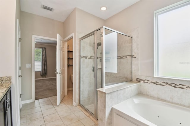 3530 Brook Crossing Dr, Brandon, FL 33511 - full bath with a shower stall, a whirlpool tub, tile patterned floors, and vanity