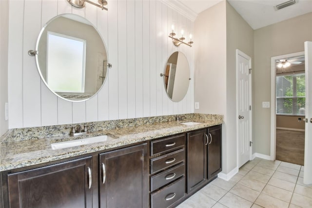 3530 Brook Crossing Dr, Brandon, FL 33511 - bathroom featuring double vanity, tile patterned flooring, a ceiling fan, and wooden walls