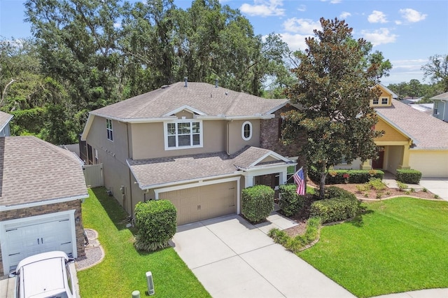 3530 Brook Crossing Dr, Brandon, FL 33511 - view of front of home featuring stucco siding, concrete driveway, a front lawn, and a garage