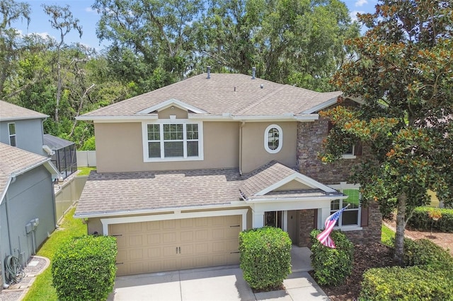 3530 Brook Crossing Dr, Brandon, FL 33511 - view of front of property with stucco siding, a shingled roof, and driveway