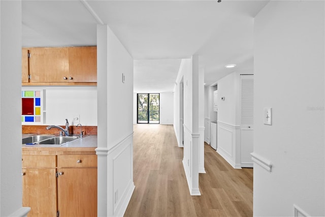 201 W Laurel St Unit 308, Tampa, FL 33602 - corridor featuring light wood-style floors and wainscoting