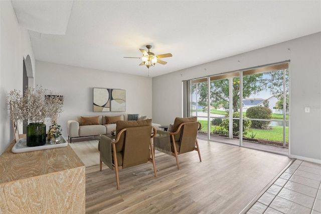 25737 Frith St, Land O Lakes, FL 34639 - living room featuring light wood-style floors, ceiling fan, and a water view