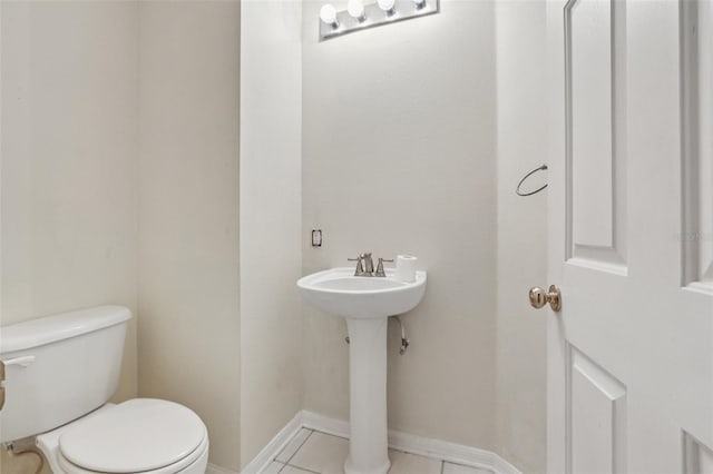 25737 Frith St, Land O Lakes, FL 34639 - half bathroom featuring toilet and tile patterned floors