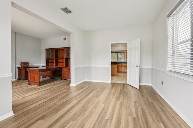25737 Frith St, Land O Lakes, FL 34639 - unfurnished office featuring healthy amount of natural light and light wood-style floors