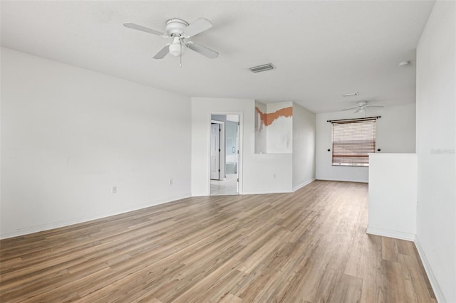 25737 Frith St, Land O Lakes, FL 34639 - unfurnished living room with ceiling fan and light wood finished floors