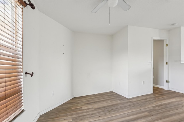 25737 Frith St, Land O Lakes, FL 34639 - empty room with wood finished floors and a ceiling fan