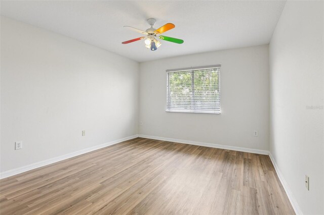 25737 Frith St, Land O Lakes, FL 34639 - unfurnished room featuring wood finished floors and a ceiling fan