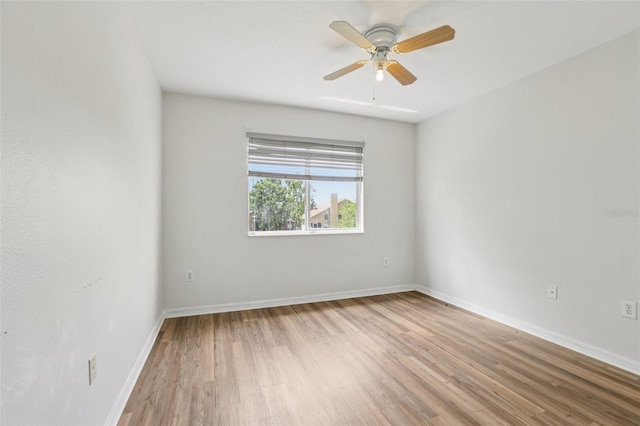 25737 Frith St, Land O Lakes, FL 34639 - empty room featuring wood finished floors and a ceiling fan