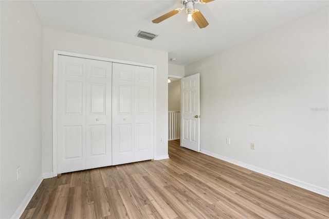 25737 Frith St, Land O Lakes, FL 34639 - unfurnished bedroom featuring light wood-style floors, a closet, and ceiling fan