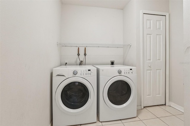 25737 Frith St, Land O Lakes, FL 34639 - laundry area featuring washing machine and clothes dryer and light tile patterned floors