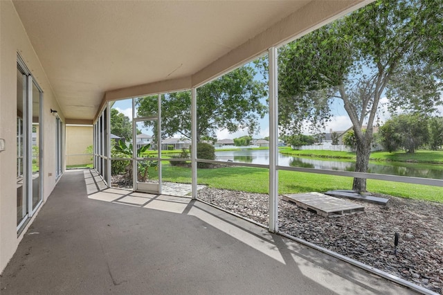 25737 Frith St, Land O Lakes, FL 34639 - unfurnished sunroom with a water view