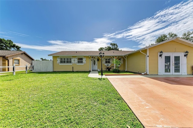 1908 N Brink Ave, Sarasota, FL 34234 - single story home featuring french doors and concrete driveway