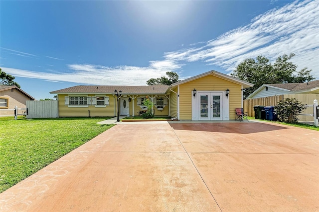 1908 N Brink Ave, Sarasota, FL 34234 - ranch-style home featuring french doors and driveway