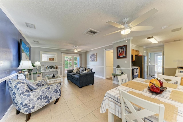 1908 N Brink Ave, Sarasota, FL 34234 - living area with ceiling fan, a textured ceiling, ornamental molding, and light tile patterned flooring