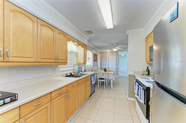 1908 N Brink Ave, Sarasota, FL 34234 - kitchen featuring appliances with stainless steel finishes, ornamental molding, a textured ceiling, light countertops, and a ceiling fan