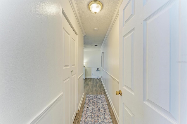 1908 N Brink Ave, Sarasota, FL 34234 - hallway with ornamental molding, a textured ceiling, and dark wood finished floors