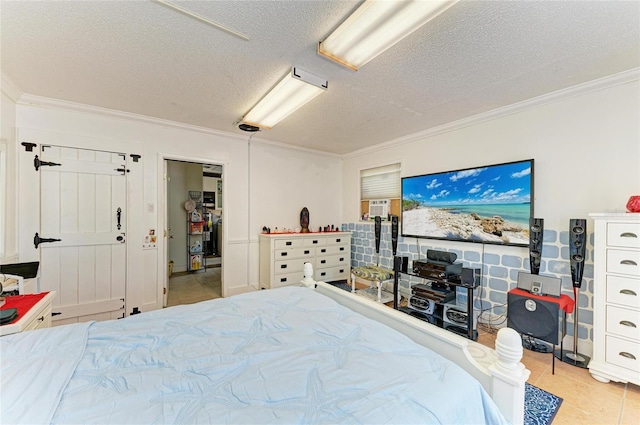 1908 N Brink Ave, Sarasota, FL 34234 - tiled bedroom featuring crown molding and a textured ceiling