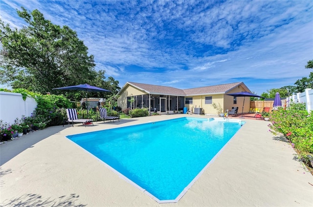 1908 N Brink Ave, Sarasota, FL 34234 - view of pool with a sunroom, a fenced backyard, and a patio area