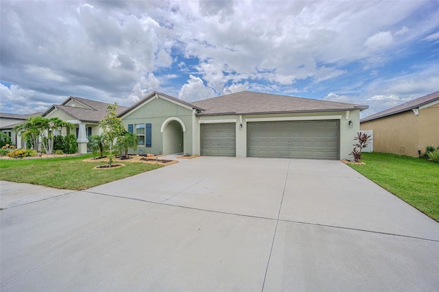 13527 Willow Bluestar Loop, Riverview, FL 33579 - ranch-style home with driveway, a garage, a front yard, and stucco siding