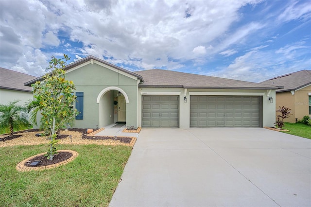 13527 Willow Bluestar Loop, Riverview, FL 33579 - ranch-style home featuring concrete driveway, an attached garage, stucco siding, and a front yard
